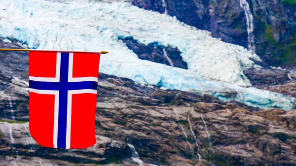 Boyabreen Glacier and norwegian flag — Stock Photo, Image