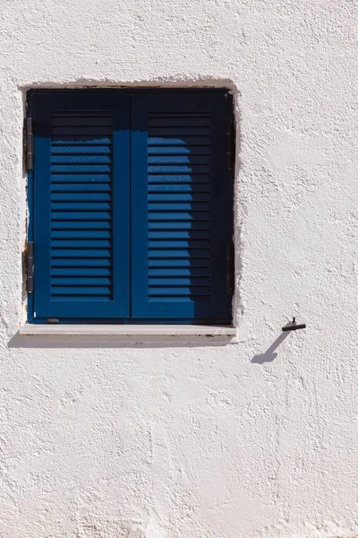 Greek blue window shutters — Stock Photo, Image