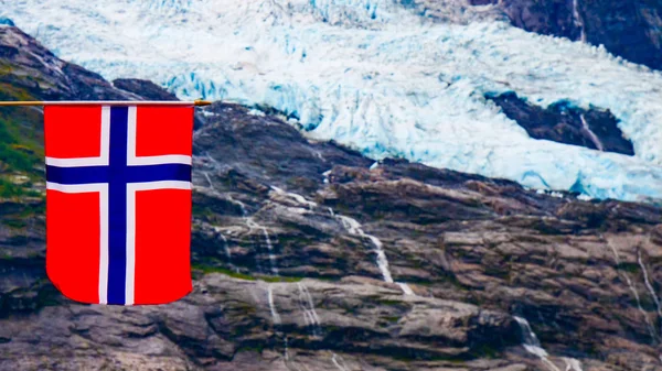 Boyabreen Glacier and norwegian flag — Stock Photo, Image