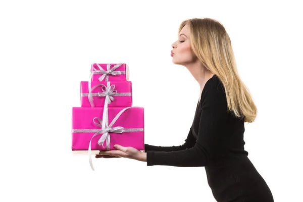 Girl holding stack of pink gift boxes — Stock Photo, Image