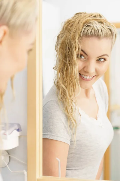 Woman with wet blonde hair