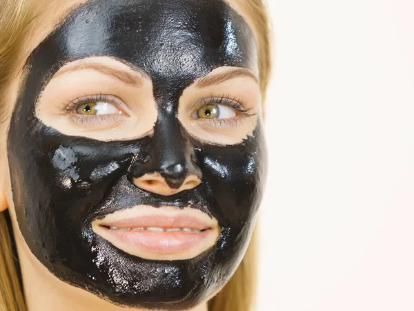 Girl black carbo peel off mask on face — Stock Photo, Image