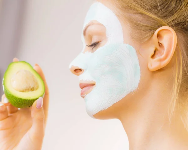 Young Woman White Green Mud Mask Face Holding Avocado Fruit — Stock Photo, Image