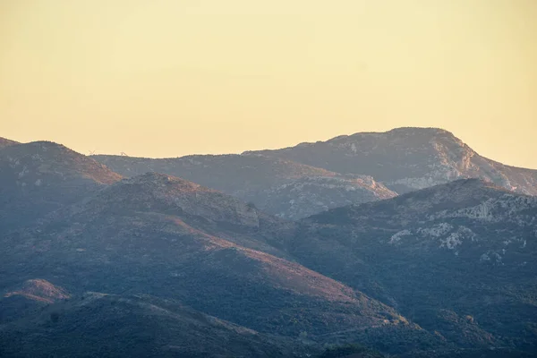 Big huge mountain against summer sunset sky. Beauty in Greece nature concept.