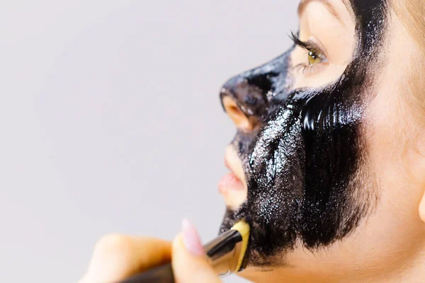 Young Woman Applying Brush Black Detox Mud Mask Her Face — Stock Photo, Image