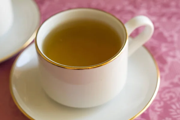 green flower tea with yellow chrysanthemum