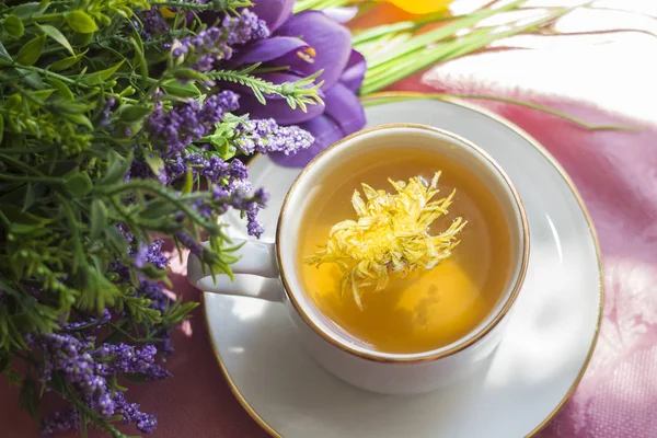 green flower tea with yellow chrysanthemum