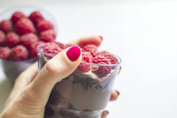 cake in a glass with cream and berries