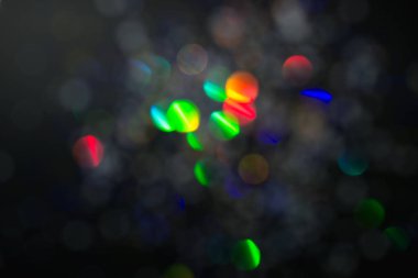 Renkli daireler ışık arka plan. Tatil doku. Gri zemin, defocused çok renkli ışık noktalar glitter