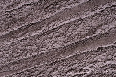 Kozmetik kil doku, arka plan. Doğal maske, yüz ve vücut için kuru siyah kil. 