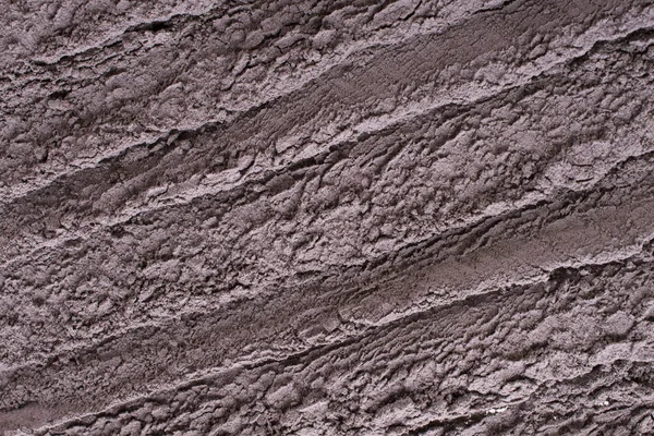 Cosmetic clay texture, background. Natural mask, dry black  clay for the face and body.
