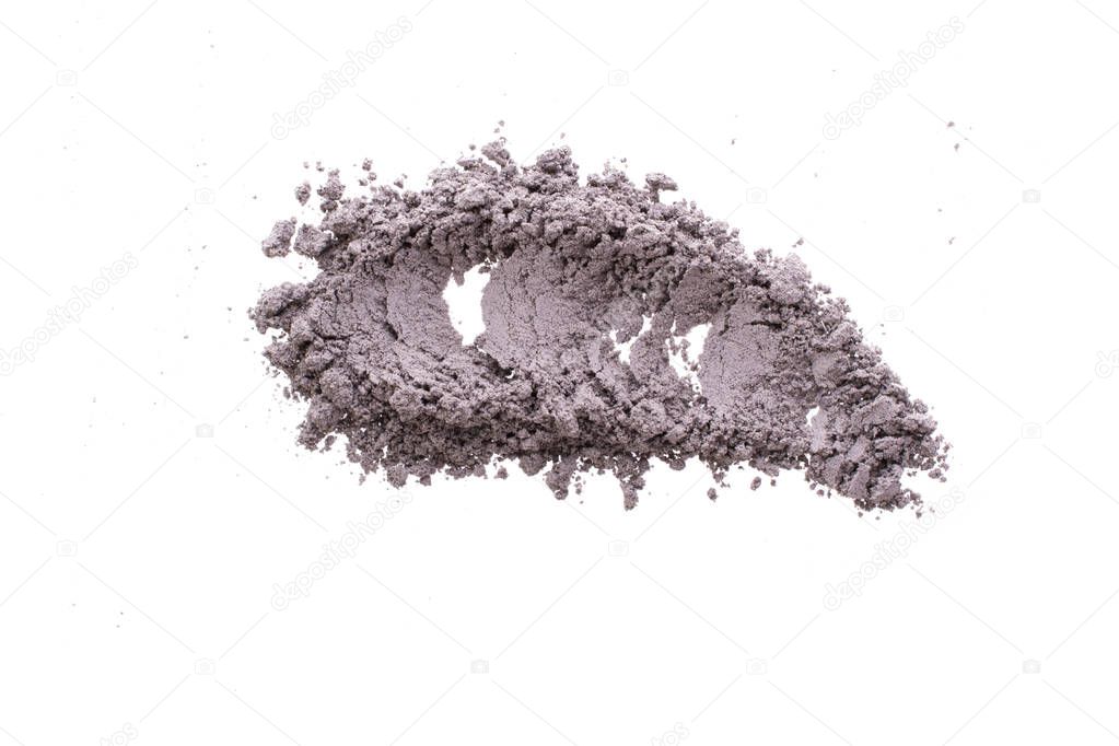 Smear from dry black  cosmetic clay. Texture of  makeup powder -  or eyeshadow. Isolated on a white background