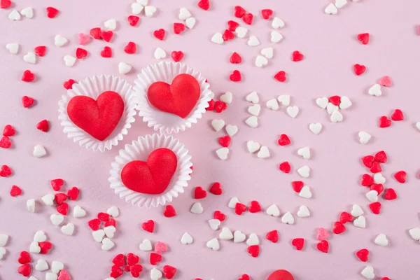 Valentines Day candy heart background of red, white and pink sprinkles