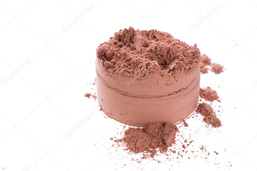 Pile off red cosmetic clay isolated on white background