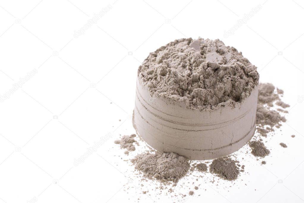 Pile of green cosmetic clay isolated on white background