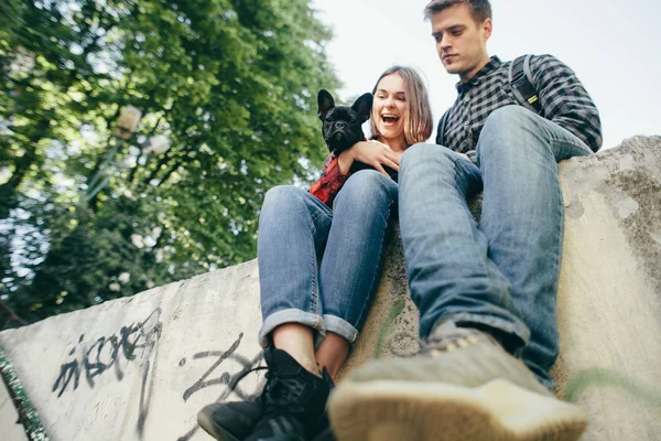 Loving couple with pet french bulldog