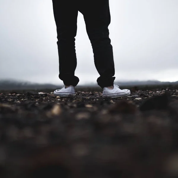 Man legs on asphalt road outdoor