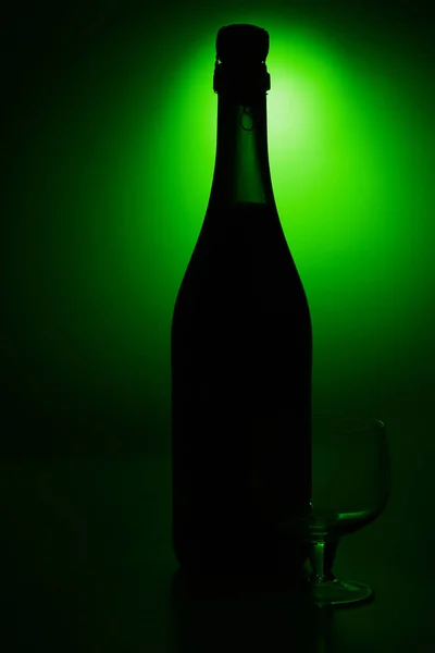 Bottle with green background