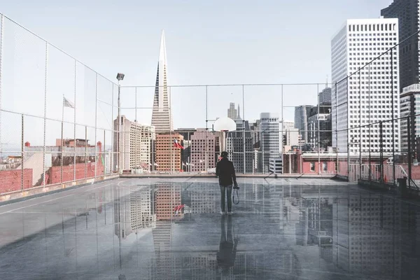 Cameraman on city building