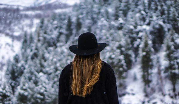 back view of woman looking mountain view  at day time