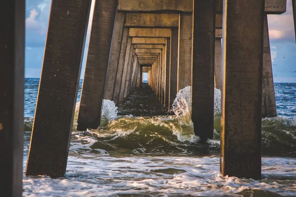 sea waves under the Bridge  at the day time