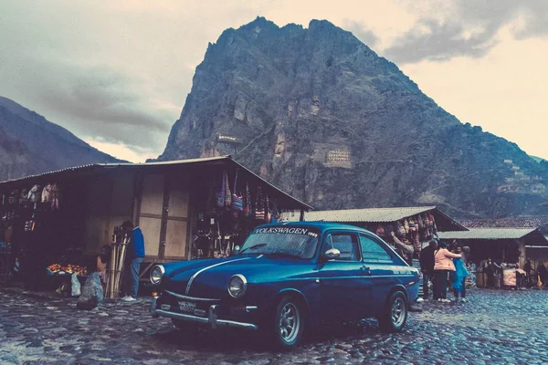 retro car and people on the mountain road