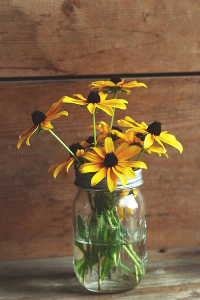 Jar of Sunflowers on the table