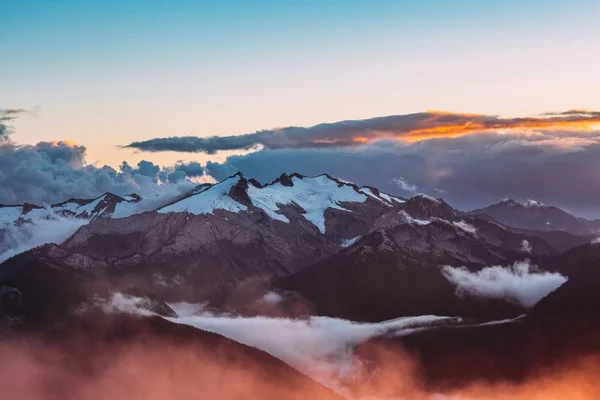 Mountains with snow   at the sunset