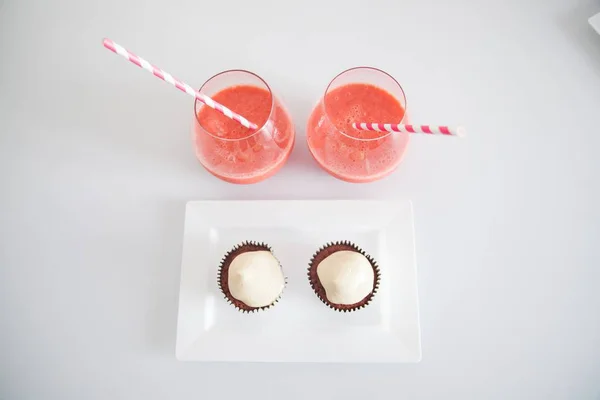 close up of Drinks and cupcakes on the plate