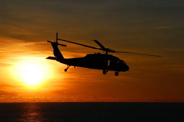 Sea Hawk Helicopter  at  the sunset