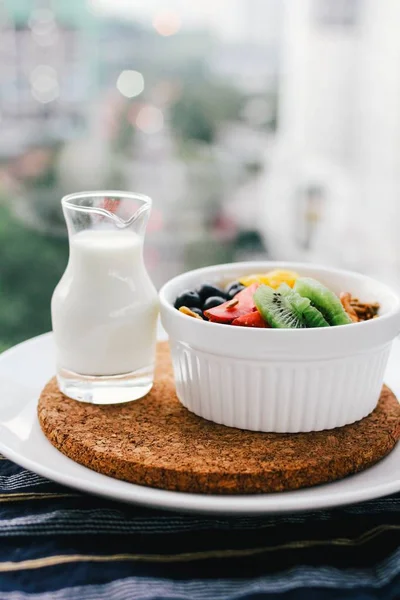 Eatables bowl of milk and fruit