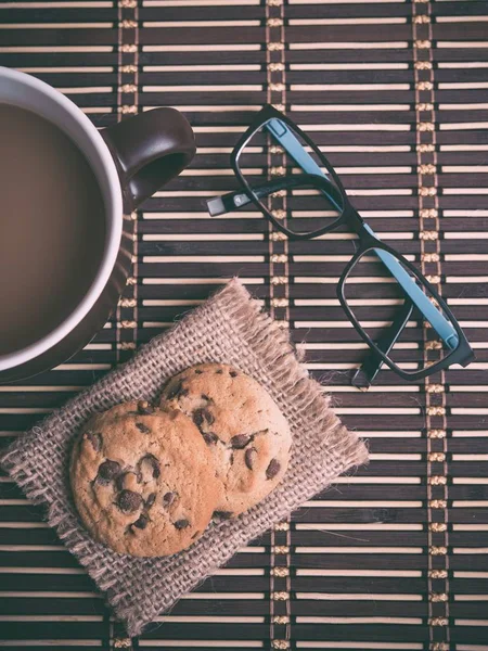 close up of tea cup with cookies