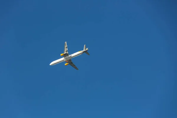 Airplane flying in blue sky