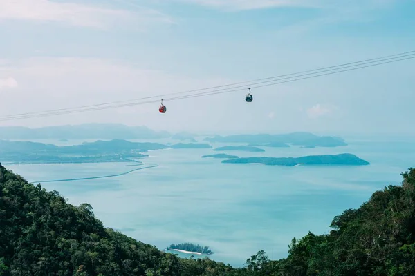 chair lift over the sea in the mountains
