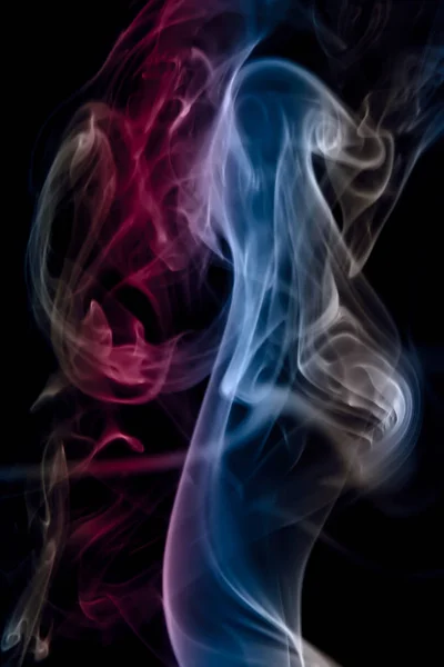 multi color smoke on black background