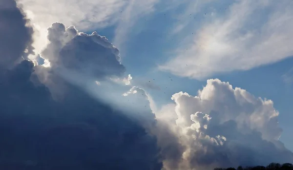 Giant Clouds with sunbeams