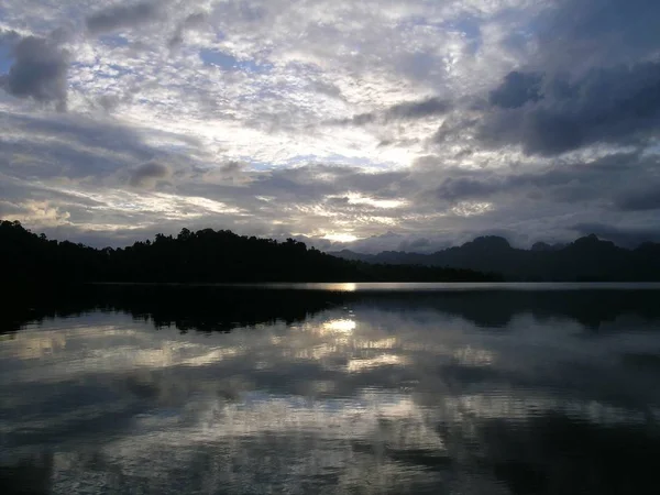 Dusk by the lake with grey sky