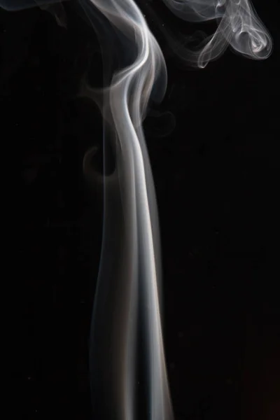 smoke magic in air on black
