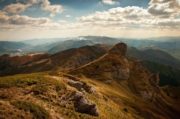 autumnal landscape with mountain peaks and clouds  .