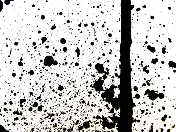 Black ink splatter on wall