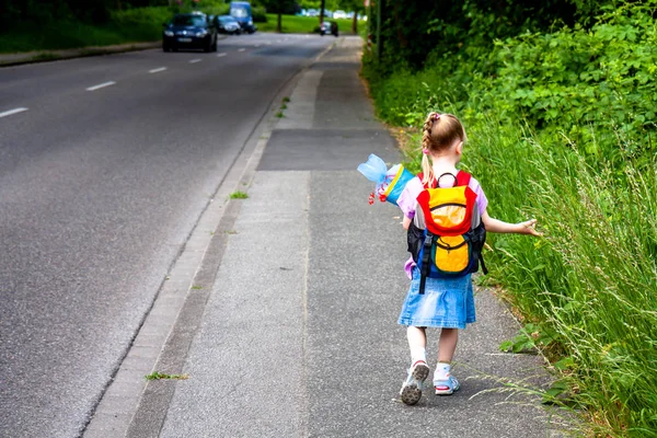 Little girl on her way to her first day of school — Stock Photo, Image