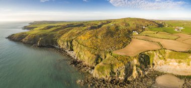 Aerial view of Church Bay in Anglesey North Wales UK during sunset clipart