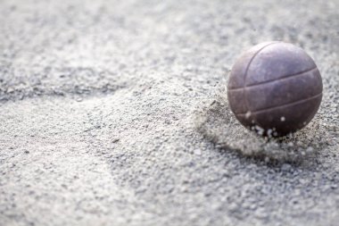 Sand flying away after ball landing on it clipart