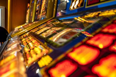 Gambling machines blinking in the casino clipart