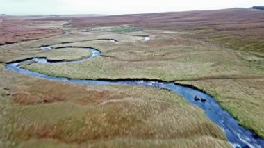 Flying over the River Lealt and Single track at Loch Cuithir and Sgurr a Mhadaidh Ruadh - Hill of the Red Fox, Isle of Skye, Scotland