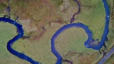 Flying over the River Lealt and Single track at Loch Cuithir and Sgurr a Mhadaidh Ruadh - Hill of the Red Fox, Isle of Skye, Scotland