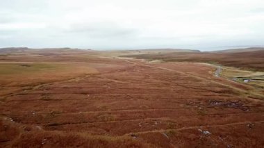 Flying over the River Lealt and Single track at Loch Cuithir and Sgurr a Mhadaidh Ruadh - Hill of the Red Fox, Isle of Skye, Scotland