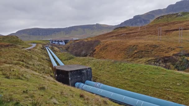 The Storr Lochs hydroelectric power station nestled under the mountains of the Trotternish Peninsula on the Isle of Skye in the West Highlands of Scotland — Stockvideo