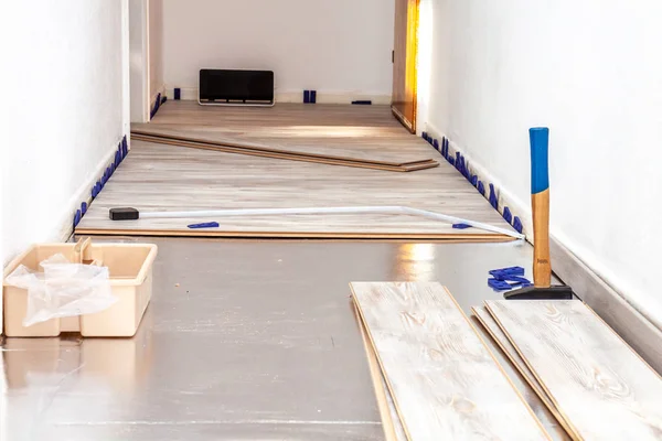 Planks of laminate floor and tools to install them — Stock Photo, Image