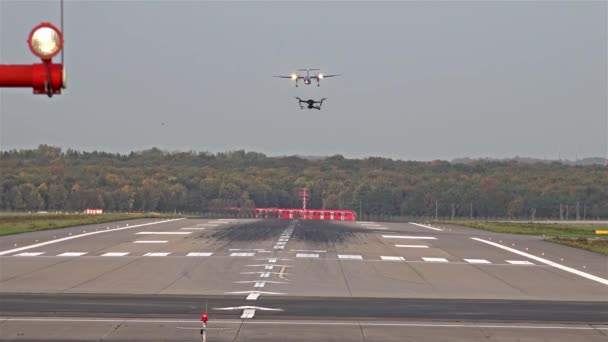 Unmanned drone flying near planes and airport — Stock Video